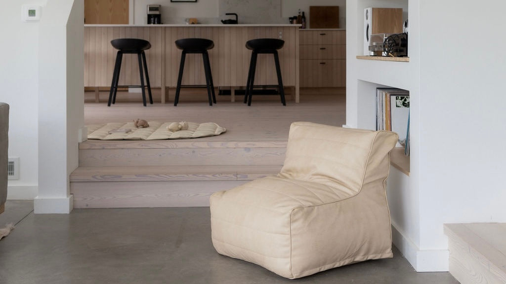 The littles lounger elevates any space with it's easy to clean leather design