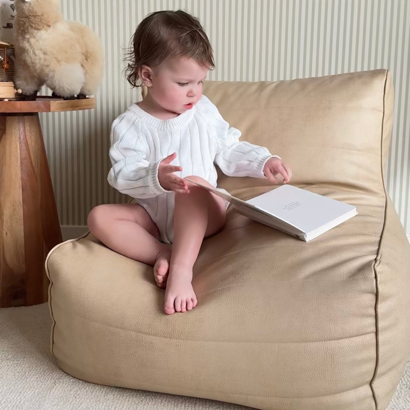 littles lounger latte and child reading in a reading nook corner